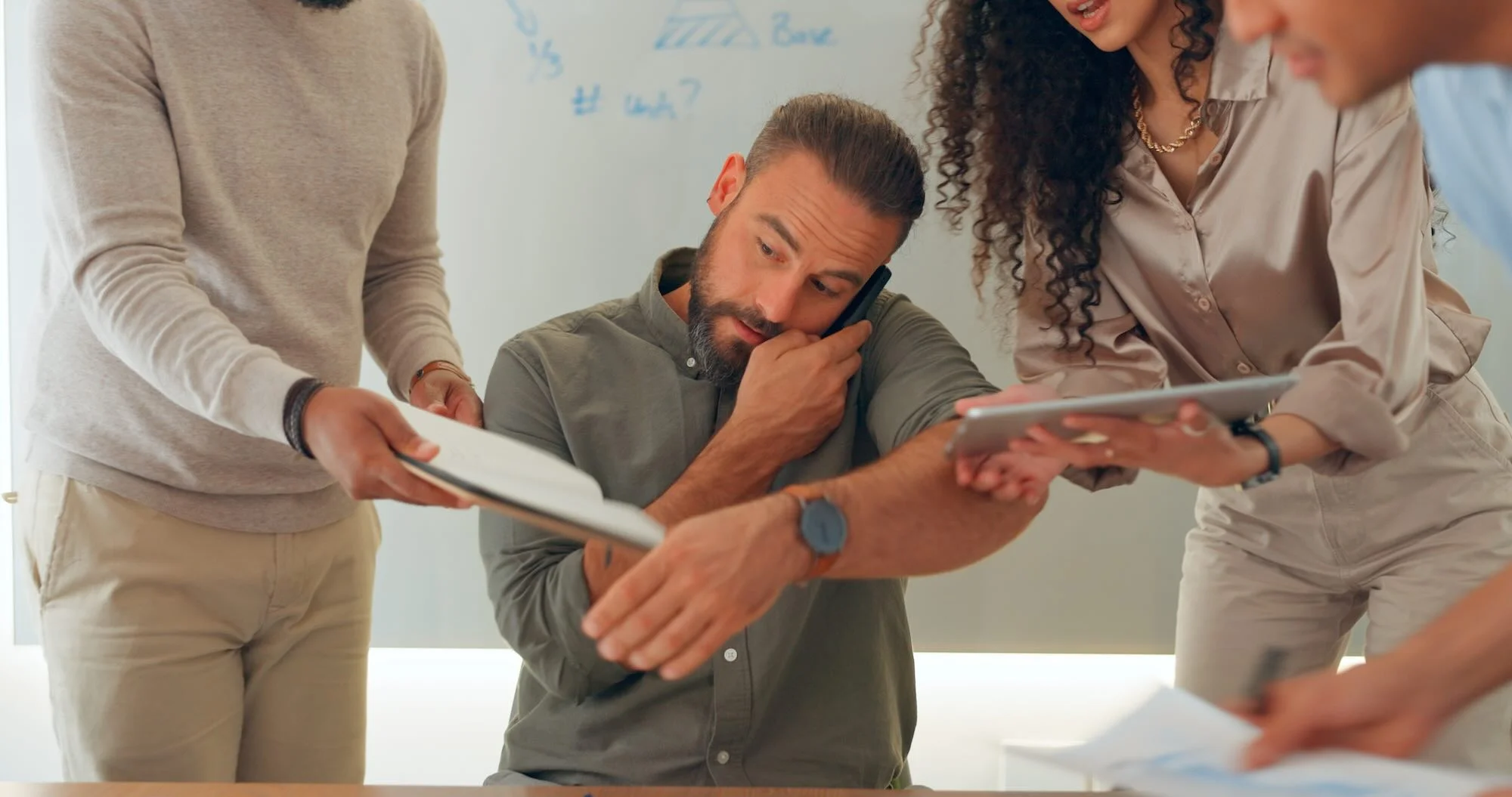 Phone call, multitasking and man with workflow crisis, business and conversation with planning, deadline and admin. People, manager and employees with chaos, schedule and staff in a workplace.
