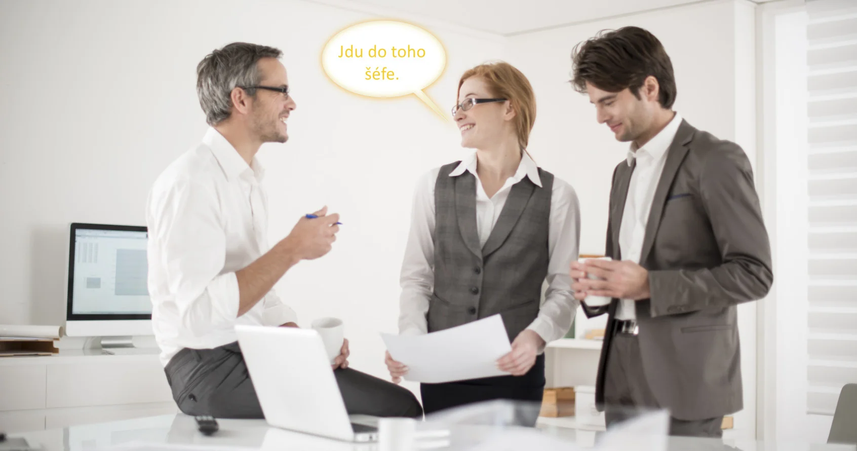 three colleagues speaks about business at office