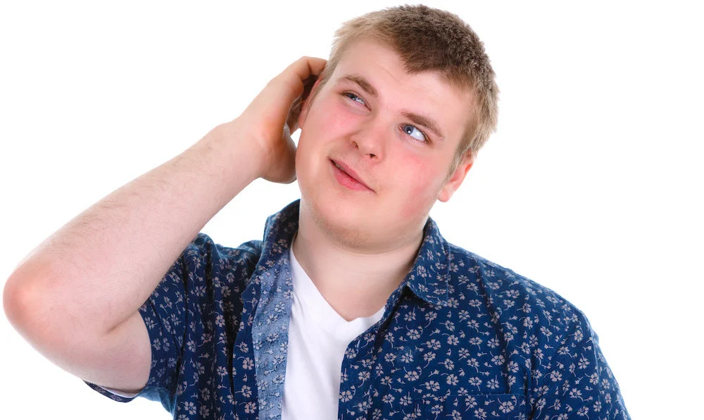 Closeup portrait of unhappy guy, sad thoughtful young business man thinking, daydreaming deeply, bothered by mistakes, hand on head looking up, isolated on white background. Negative emotions