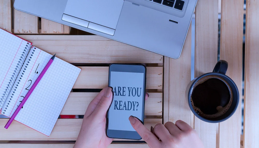 Writing note showing Are You Ready Question. Business concept for used telling someone start something when feel prepared woman with laptop smartphone and office supplies technology